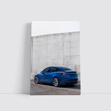 Tesla Model 3 Blue Against Concrete Wall