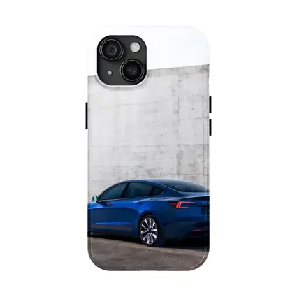 Tesla Model 3 Blue Against Concrete Wall