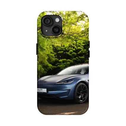 Tesla Model 3 Parked Among Green Trees