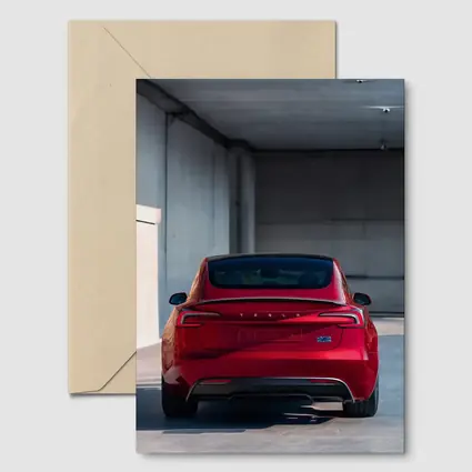 Red Tesla Model Three Rear Parking Garage
