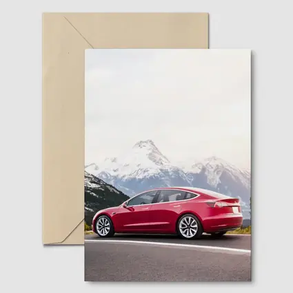 Red Tesla Model 3 Snow Mountain Road