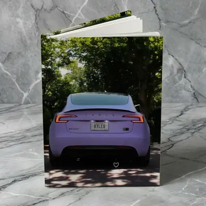 Purple Tesla Model Three Tree Lined Street