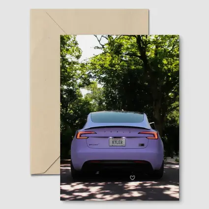 Purple Tesla Model Three Tree Lined Street
