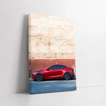 Red Tesla Model S Against Stone Wall