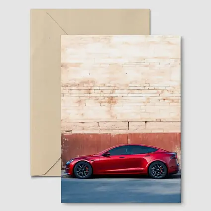 Red Tesla Model S Against Stone Wall