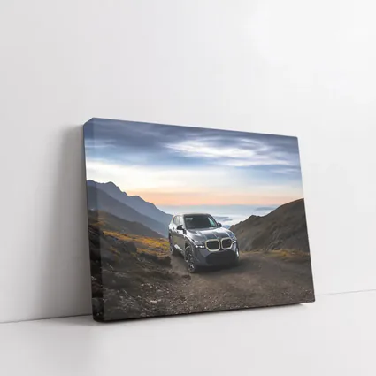 BMW XM SUV Mountain Road Dramatic Sky