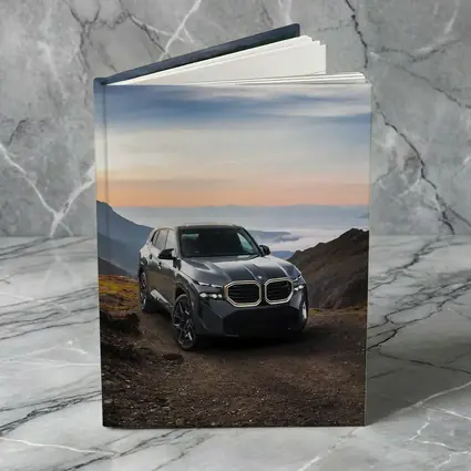 BMW XM SUV Mountain Road Dramatic Sky