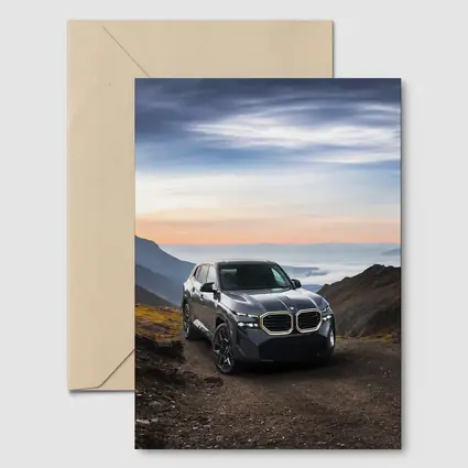 BMW XM SUV Mountain Road Dramatic Sky