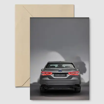 Toyota Camry Hybrid Rear View Gray Background