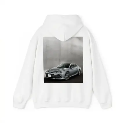 Toyota Camry Silver Sedan Against Gray Wall