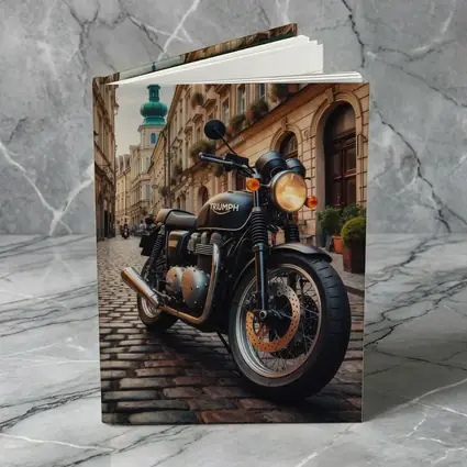 Triumph Motorcycle Parked on European Cobblestone Street