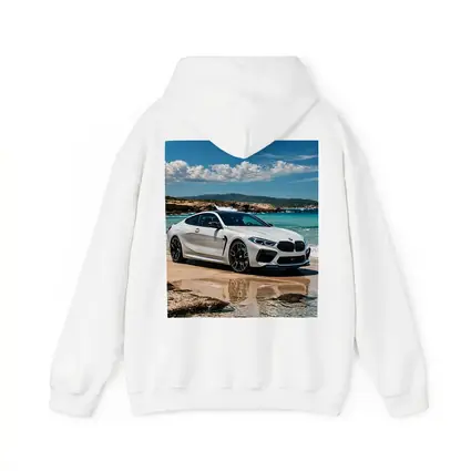 White BMW M8 Parked on Sunny Beach