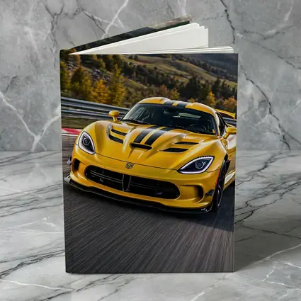 Yellow Dodge Viper Racing on Track