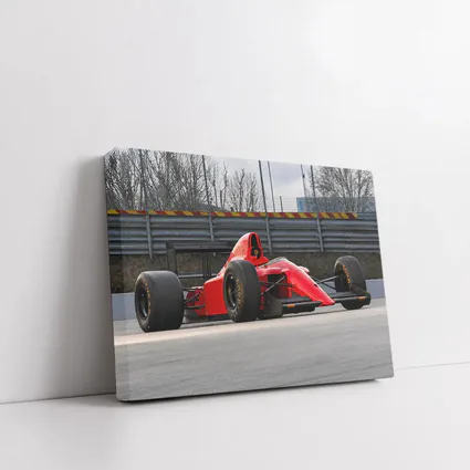 Red Formula One Car On Racing Circuit