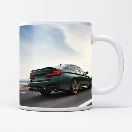 BMW M5 CS Green Sedan on Open Highway