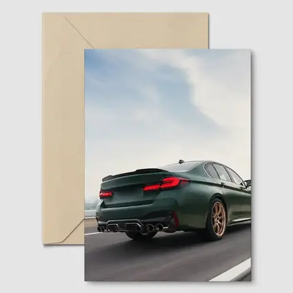 BMW M5 CS Green Sedan on Open Highway