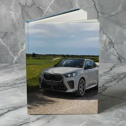 BMW X6M Silver on Rural Gravel Road