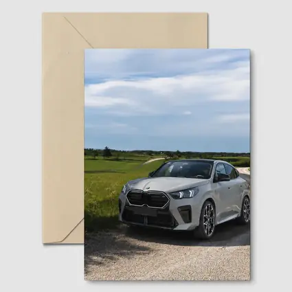 BMW X6M Silver on Rural Gravel Road