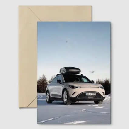 Smart Car Parked On Snowy Winter Landscape